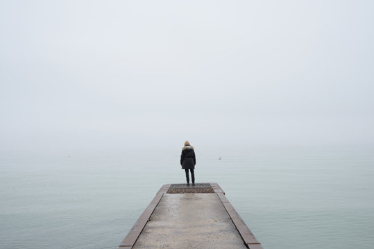 Woman on Foggy Lake