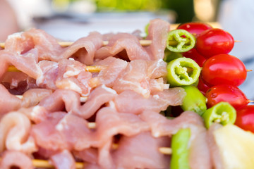 A lot of pork meat was made barbecue with chili pepper, tomato and pineapple for dinner party at backyard