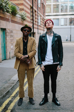 Two stylish yet oppositely dressed men in a street in London
