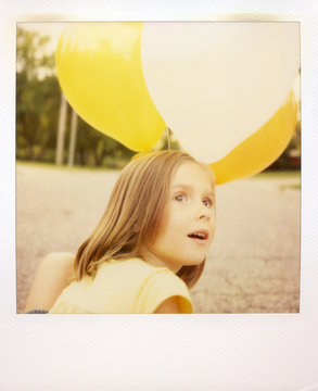 A Girl Watching One Of Her Balloons Float Away On A Spring Evening