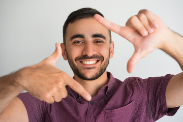 Happy Young Attractive Man Making Frame Gesture