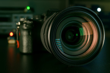 Photo Camera or Video lens close-up on black background DSLR objective