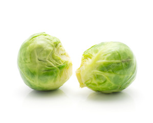 Boiled Brussels sprout isolated on white background two heads.