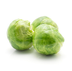 Boiled Brussels sprout isolated on white background three whole heads.