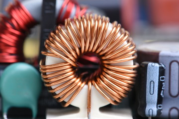 Inductor copper coil on circuit board - obrazy, fototapety, plakaty