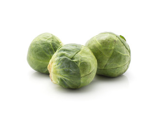 Raw Brussels sprout three heads isolated on white background.