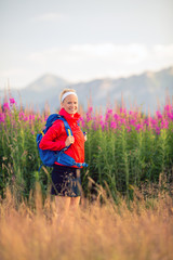 Woman hiking in mountains, adventure and travel