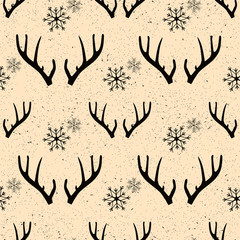 seamless winter pattern with white snowflakes and deer antlers. vector flat Christmas ornament. winter reindeer texture.