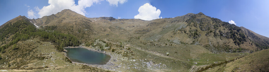 Fototapeta na wymiar Mountain lake landscape on the alps with beautiful sky