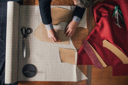 Tailor Working With Clothes Patterns