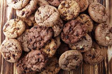 Chocolate cookies on wooden table. Chocolate chip cookies shot