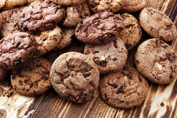 Chocolate cookies on wooden table. Chocolate chip cookies shot