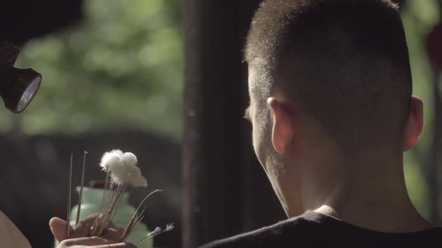 Chengdu man gets his ears cleaned