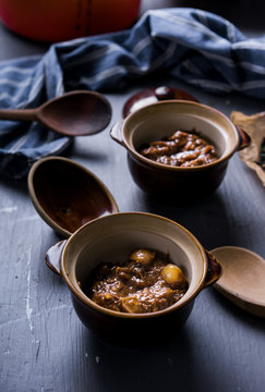 Beef And Mushroom Stew Served In Individual Bowls.