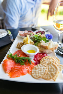 sharing seafood platter at a winery