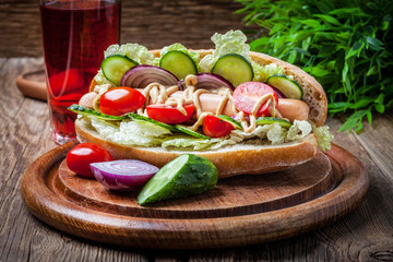 Homemade sandwich on a wooden table.
