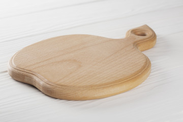 wooden cutting board for food on the table