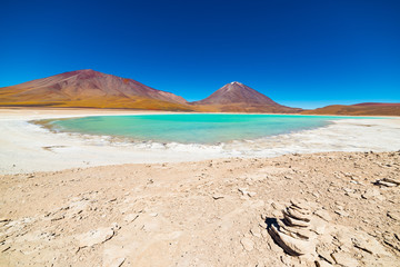 Green Lagoon or "Laguna Verde", frozen salt lakeroad trip to the famous Uyuni Salt Flat, travel destination in Bolivia. Snowcapped Licancabur Volcano, 5920 m, in the background.