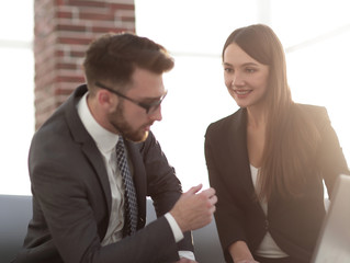 Two coworkers working on new business strategy