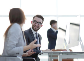 prospective employees are talking at their Desk