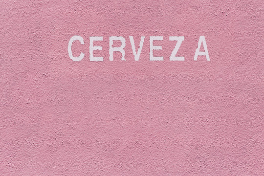 The Word Cerveza Written on a Pink Wall