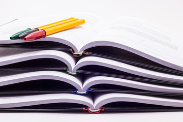 Four books with multi-colored handles