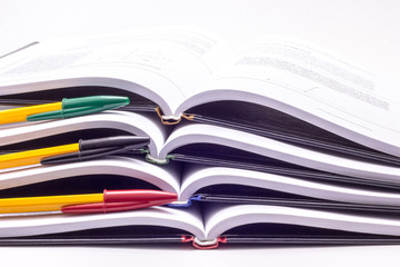 Four books with multi-colored handles