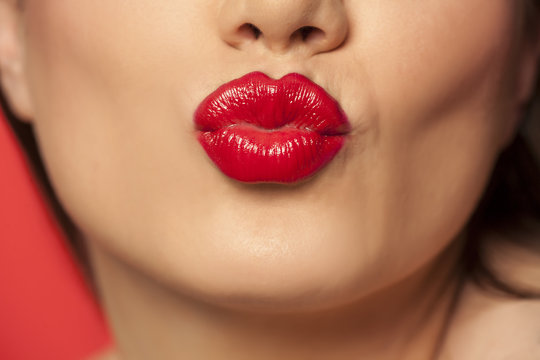 woman's lips with red lipstick