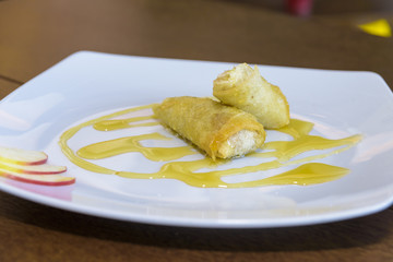 sweet spring rolls served on a plate