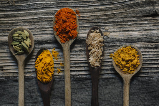 Spices assortment on wooden spoons