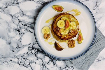 Gluten free banana pancakes on the light background. Top view