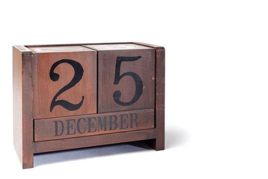 Wooden Perpetual Calendar set to December 25th, Christmas Day