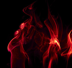 Red smoke on black background