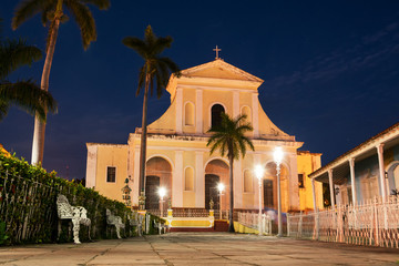 Fototapeta na wymiar Trinidad Cathedral illuminated by streetlights in the blue hour