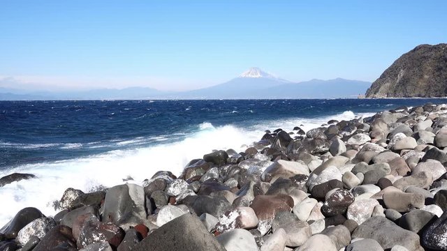 Mt. Fuji over the Rough Sea