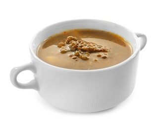 Casserole with tasty lentil soup on white background