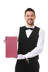Handsome waiter with menu on white background