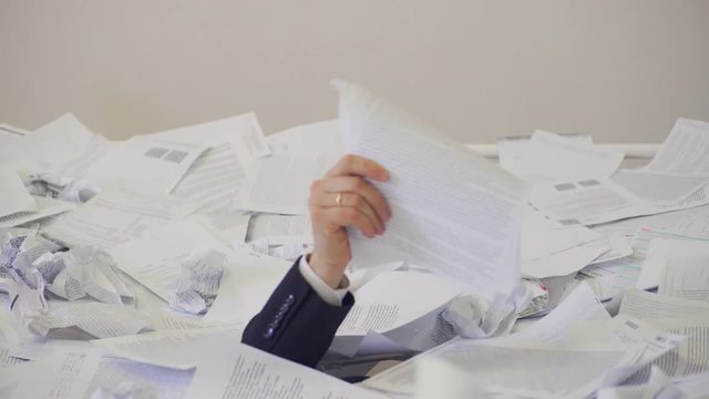 the man found an important document in the bunch of unnecessary documents.