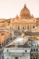 Fototapeta na wymiar Panorama of Rome and Basilica of St. Peter at sunset in Vatican, Italy.