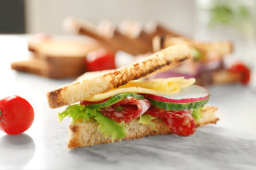 Delicious sandwich on marble board, closeup