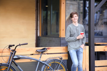 Fototapeta na wymiar Hipster teenager with bicycle outdoors