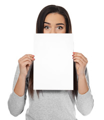 Young woman with blank sheet of paper for advertising on white background