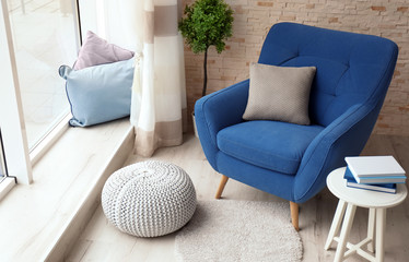 Interior of living room with comfortable armchair