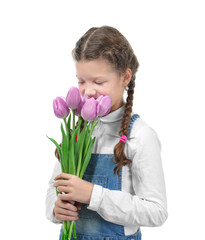 Cute little girl with tulip bouquet for Mother's day on white background