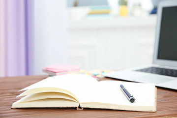 Notebook and pen on table indoors, closeup. Doing homework
