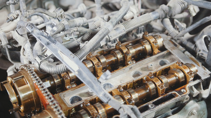 The internal combustion engine, disassembled, repair at car service, overhaul, under the hood of the car