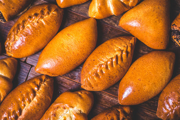 Pies from the oven lie on the table.