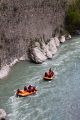 Rafting in a river of Huesca, Spain. Rafting at Tara mountain river. Group of tourists in the inflatable raft