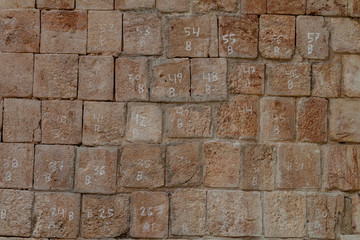 Stones with numerical identification at the ruins of the ancient Mayan city Uxmal, Mexico