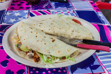 Portion of quesadillas in a restaurant in Tulum, Mexico.